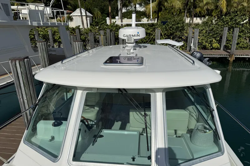 Slide: The Image of 2020 Back Cove 34O boat with Garmin radar, docked in a marina. - 12