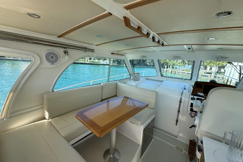 Slide: The Image of Interior of 2020 Back Cove 34O yacht with elegant seating and waterfront view. - 3