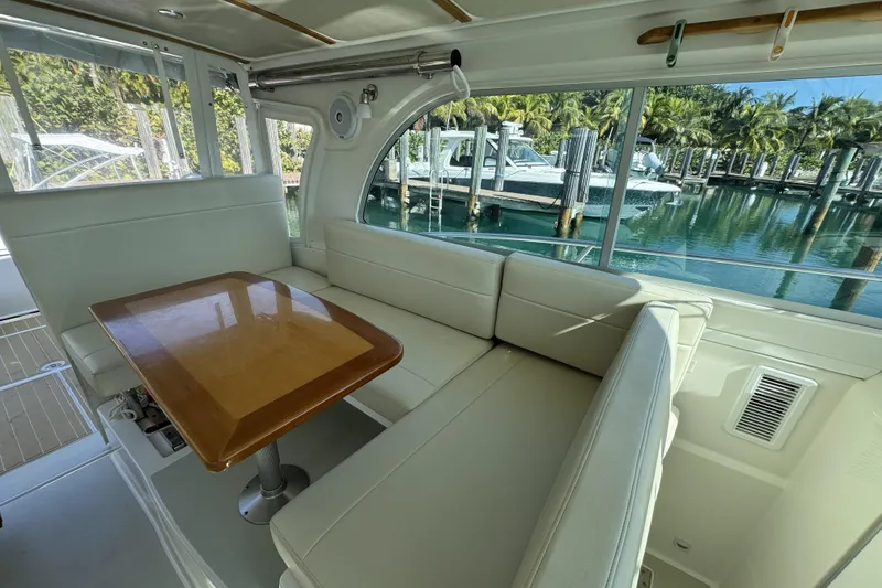 Slide: The Image of Interior of 2020 Back Cove 34O yacht with elegant seating and wooden table. - 30