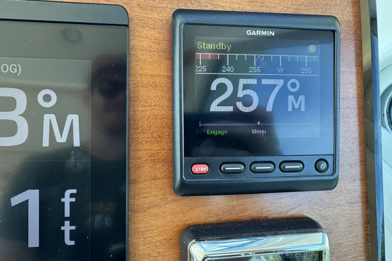 Slide: The Image of Garmin navigation display on 2020 Back Cove 34O boat dashboard, showing 257° heading. - 33