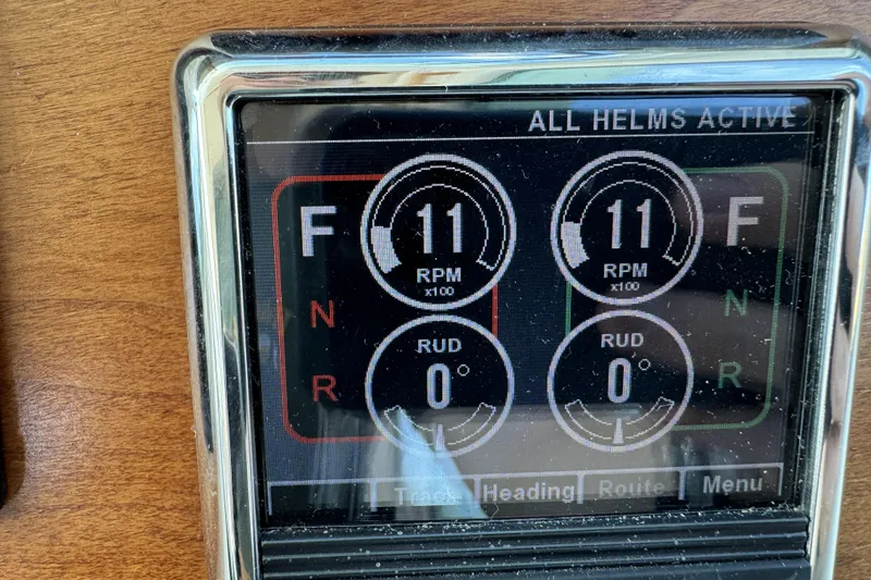 Slide: The Image of Display panel of 2020 Back Cove 34O showing RPM and rudder settings. - 34