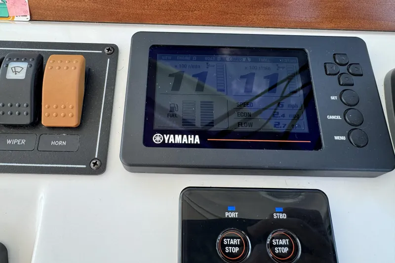 Slide: The Image of Yamaha control panel on 2020 Back Cove 34O boat dashboard. - 36