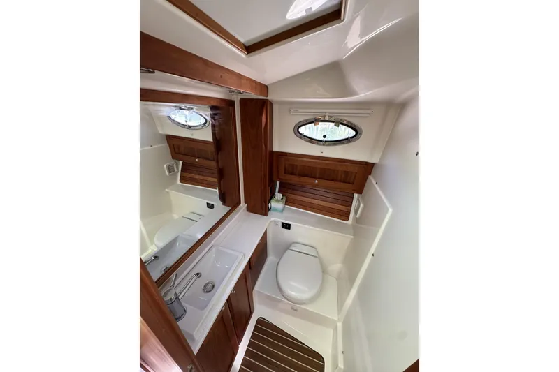 Slide: The Image of 2020 Back Cove 34O yacht bathroom with wooden accents and modern fixtures. - 39