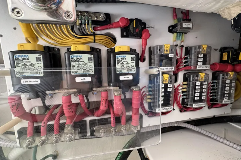 Slide: The Image of Electrical panel of a 2020 Back Cove 34O boat with labeled components and wiring. - 46