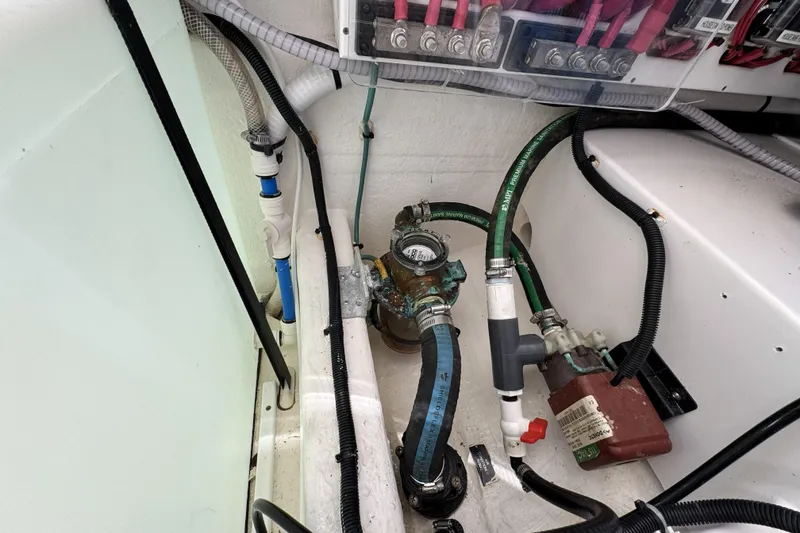 Slide: The Image of Engine compartment of 2020 Back Cove 34O boat, showing hoses and electrical connections. - 47