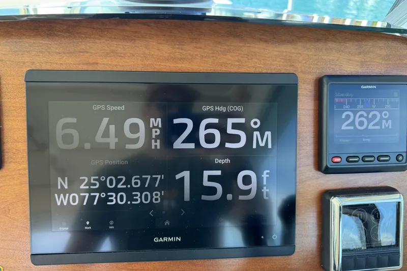 Slide: The Image of Garmin navigation display on 2020 Back Cove 34O boat showing speed, heading, and depth. - 5