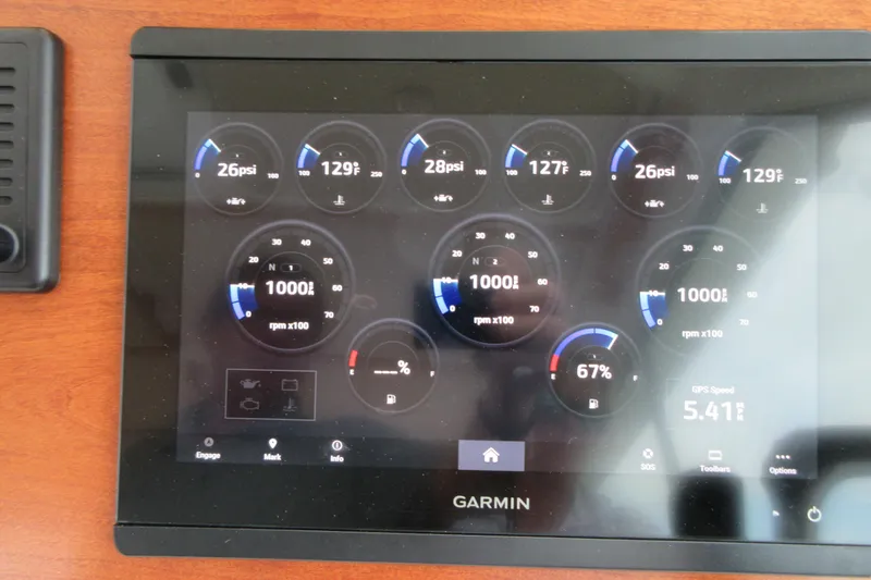 Slide: The Image of Garmin display on 2020 Back Cove 34O showing engine metrics and GPS speed. - 55