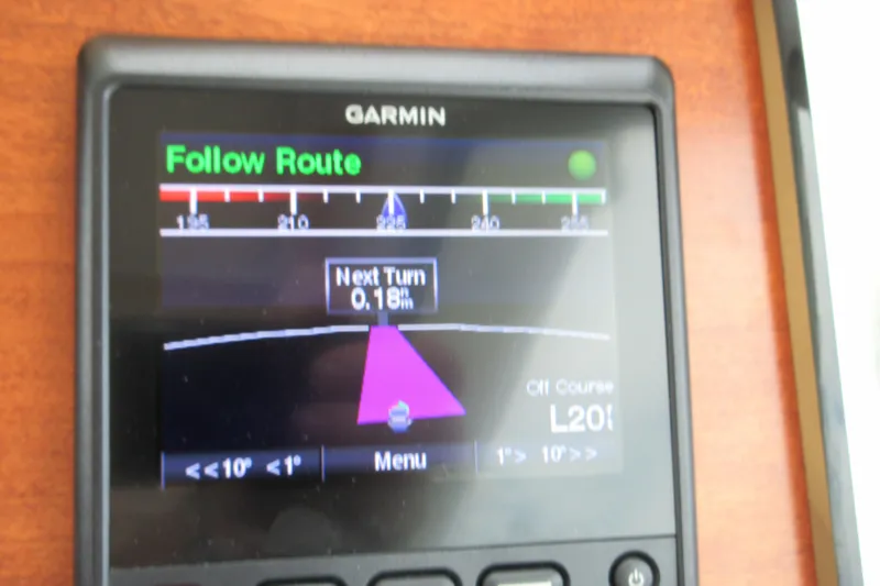 Slide: The Image of Garmin navigation display on 2020 Back Cove 34O, showing route and next turn details. - 58