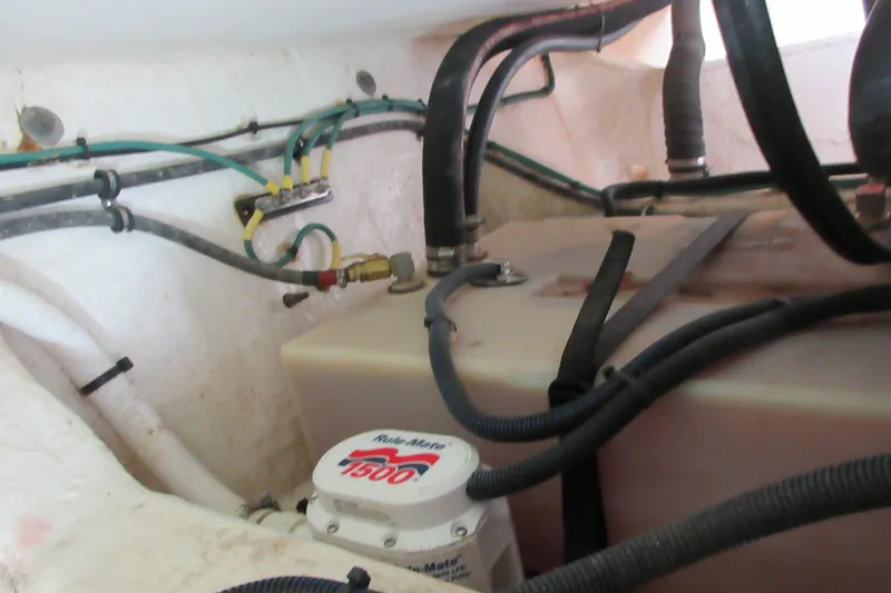 Slide: The Image of Engine compartment of 2020 Back Cove 34O with wiring and pump system. - 64