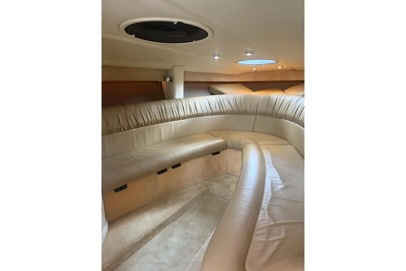 Slide: The Image of Luxurious interior of a 2007 Cobalt 343 boat with plush seating and ambient lighting. - 9