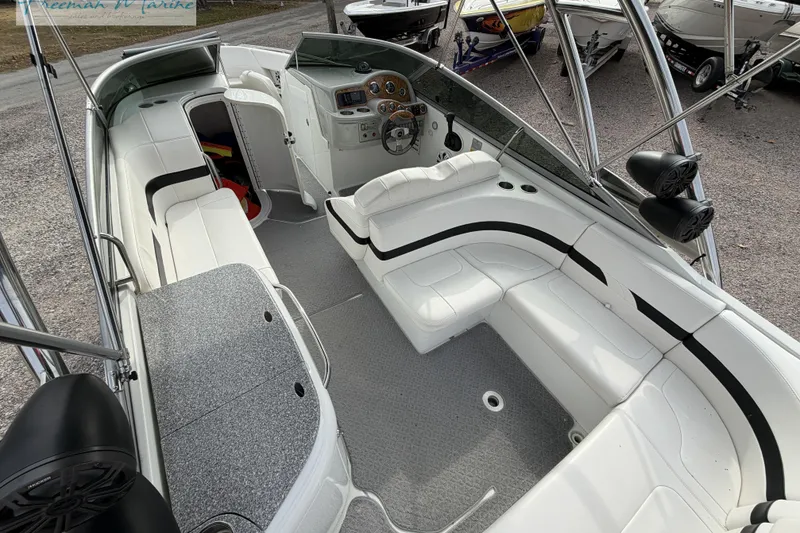 Slide: The Image of 2007 Formula 260 Bowrider interior with white seating and modern dashboard. - 10