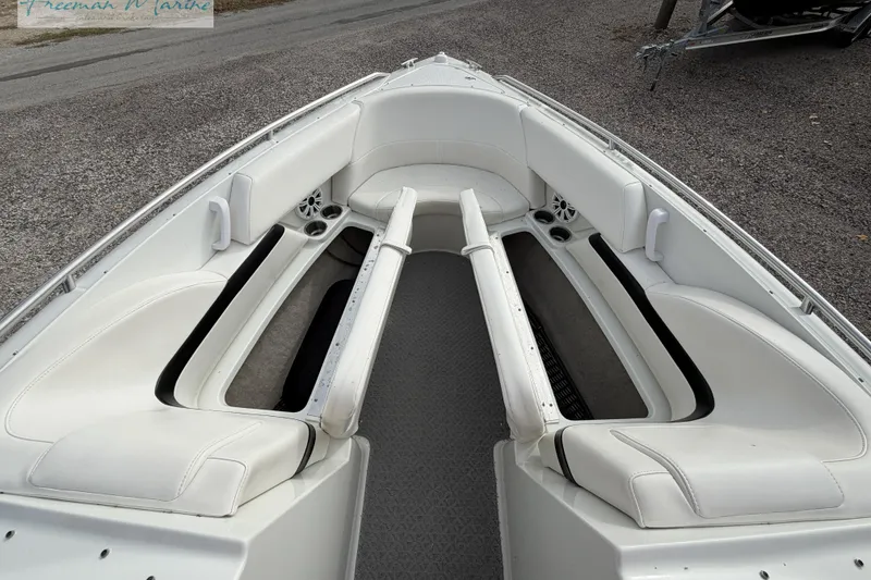Slide: The Image of 2007 Formula 260 Bowrider interior with white seating and storage compartments. - 11