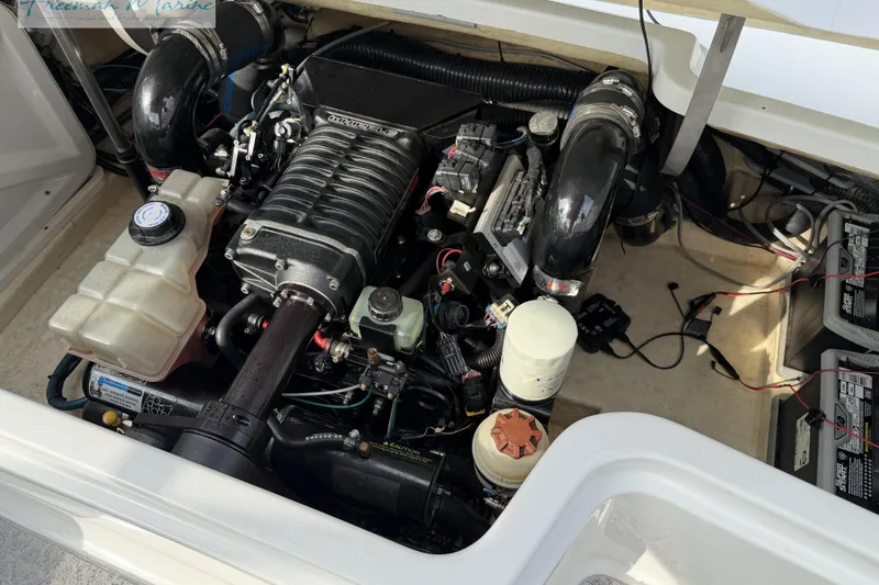 Slide: The Image of Engine compartment of a 2007 Formula 260 Bowrider boat, showcasing detailed components. - 24