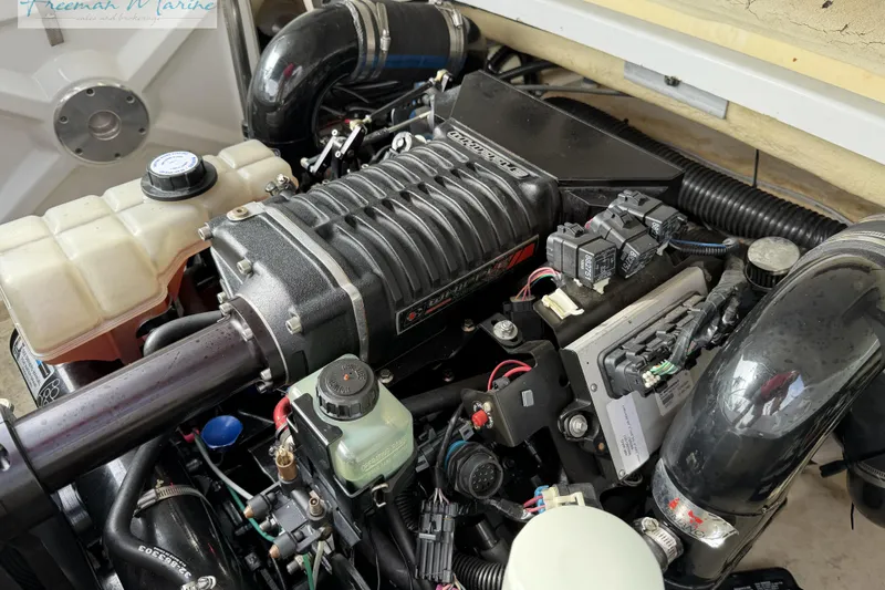 Slide: The Image of Engine compartment of a 2007 Formula 260 Bowrider boat, showcasing detailed components. - 27