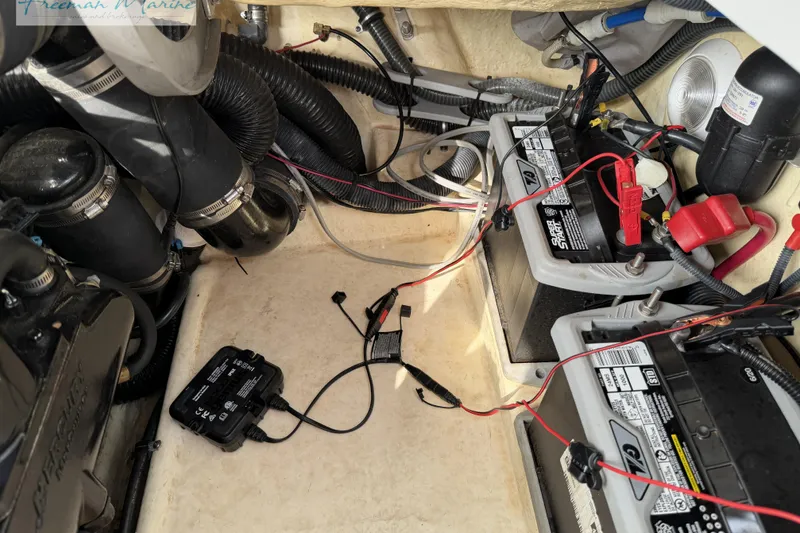 Slide: The Image of 2007 Formula 260 Bowrider engine compartment with batteries and wiring. - 28