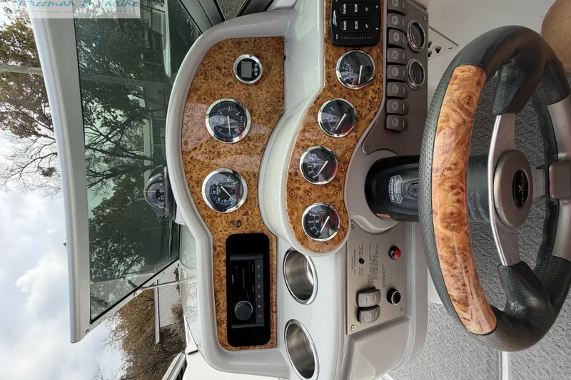 Slide: The Image of 2007 Formula 260 Bowrider dashboard with wood accents and steering wheel. - 32