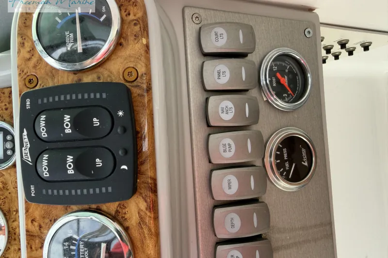 Slide: The Image of Dashboard controls of a 2007 Formula 260 Bowrider boat with gauges and switches. - 33