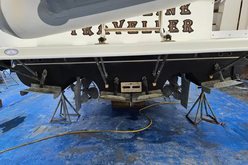 Slide: The Image of Interior of 1991 Bayliner 3888 Motoryacht with seating, ladder, and marina view. - 10