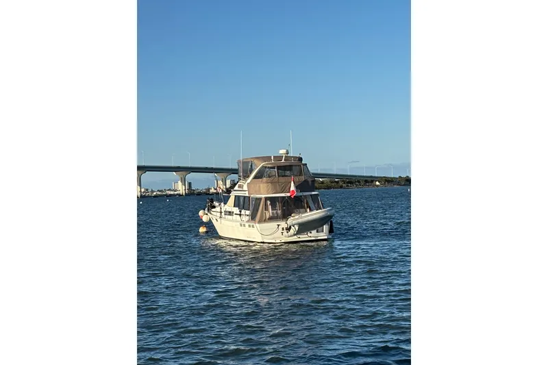 Slide: The Image of Luxurious interior of 1991 Bayliner 3888 Motoryacht with plush seating and elegant table. - 13