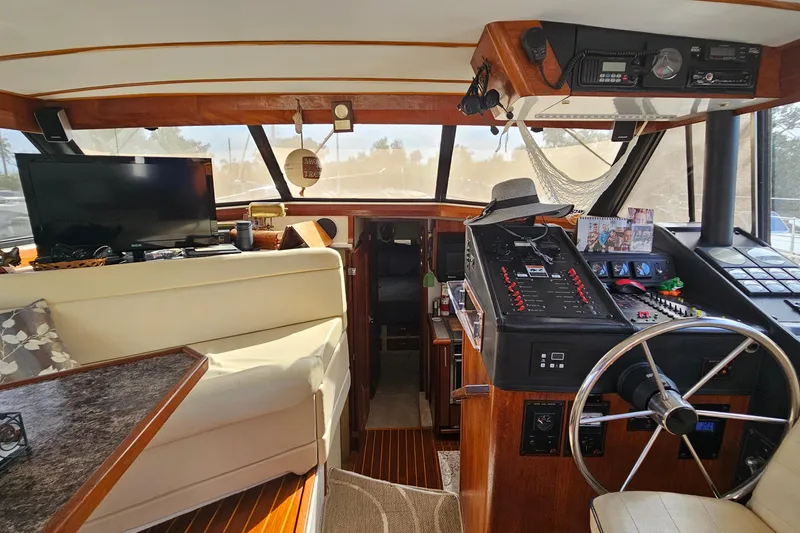 Slide: The Image of Interior of a 1991 Bayliner 3888 Motoryacht with helm, seating, and electronics. - 14