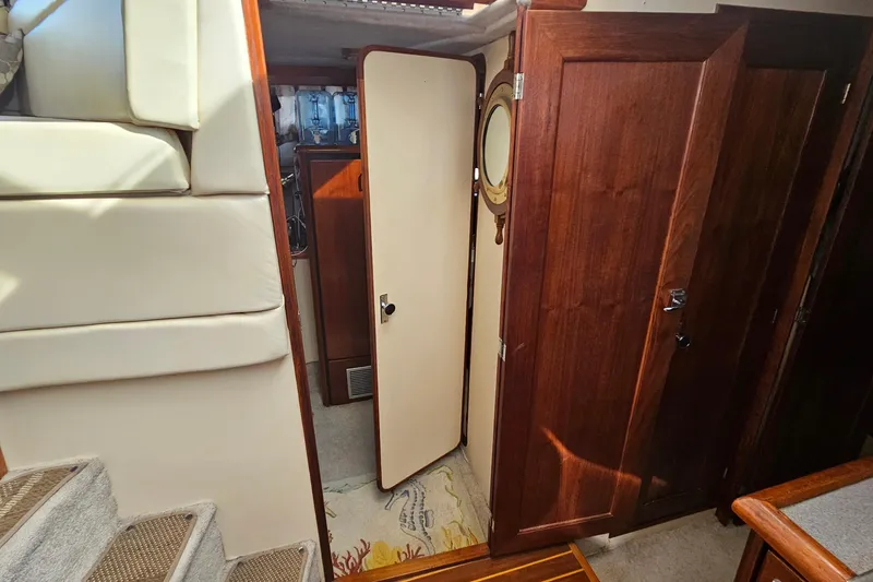 Slide: The Image of Interior of 1991 Bayliner 3888 Motoryacht with wooden doors and carpeted stairs. - 20