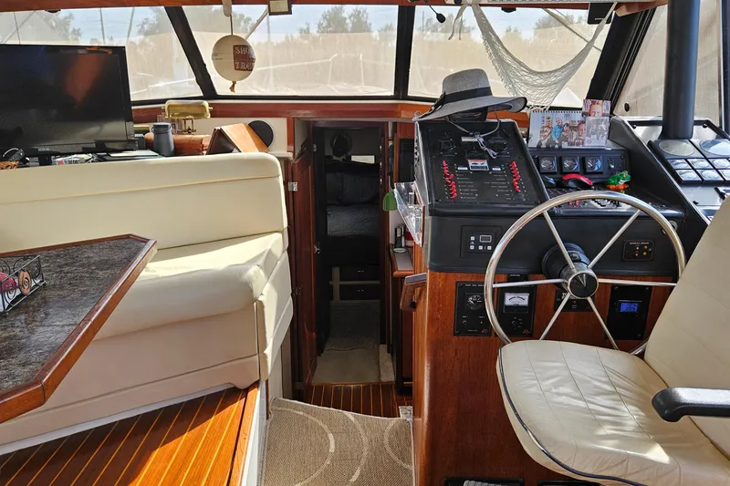 Slide: The Image of Interior of 1991 Bayliner 3888 Motoryacht with helm, seating, and navigation equipment. - 30