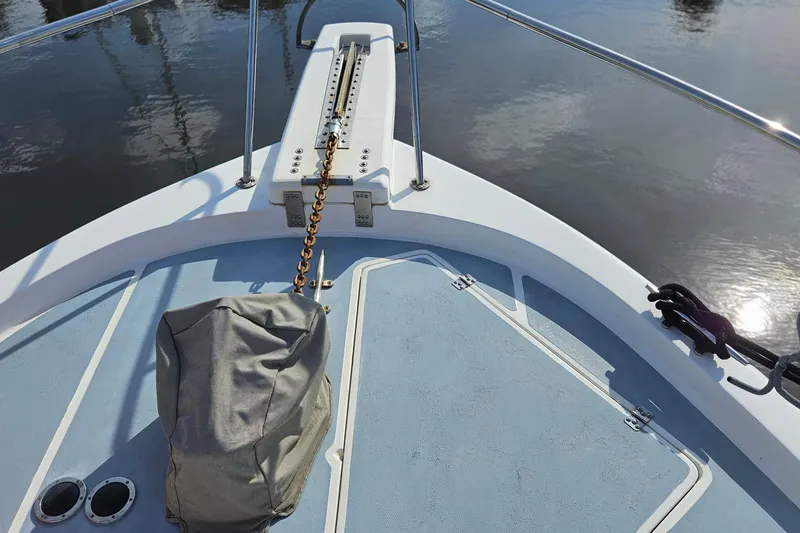 Slide: The Image of Bow of 1991 Bayliner 3888 Motoryacht with anchor chain and calm water reflection. - 33