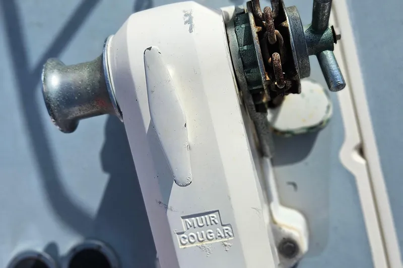 Slide: The Image of Anchor windlass on 1991 Bayliner 3888 Motoryacht deck, featuring Muir Cougar branding. - 34