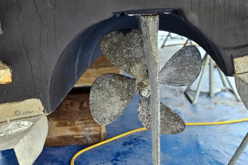 Slide: The Image of Propeller of 1991 Bayliner 3888 Motoryacht on dry dock, showing wear and marine growth. - 36