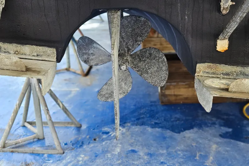 Slide: The Image of Propeller of 1991 Bayliner 3888 Motoryacht on dry dock, showing wear and marine growth. - 37