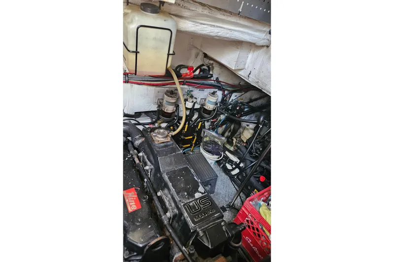 Slide: The Image of Engine room of 1991 Bayliner 3888 Motoryacht with visible components and wiring. - 41