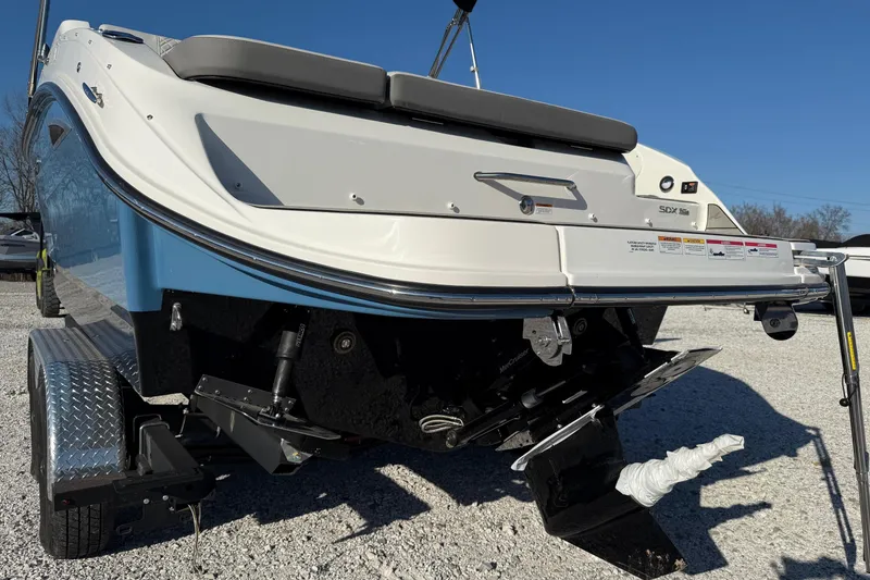 Slide: The Image of 2026 Sea Ray SDX 230 boat rear view on trailer, showcasing sleek design. - 5