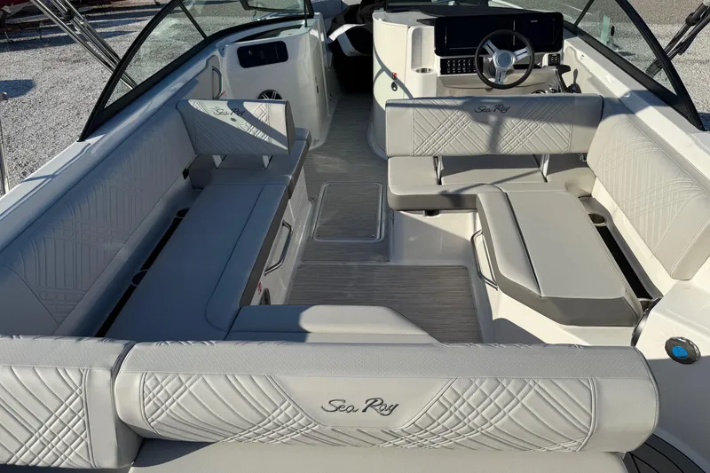 Slide: The Image of 2026 Sea Ray SDX 230 boat interior with luxurious seating and modern dashboard. - 8