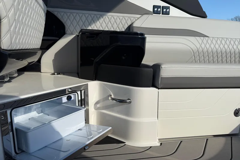 Slide: The Image of 2026 Sea Ray SLX 280 boat interior with luxurious seating and built-in storage compartment. - 15