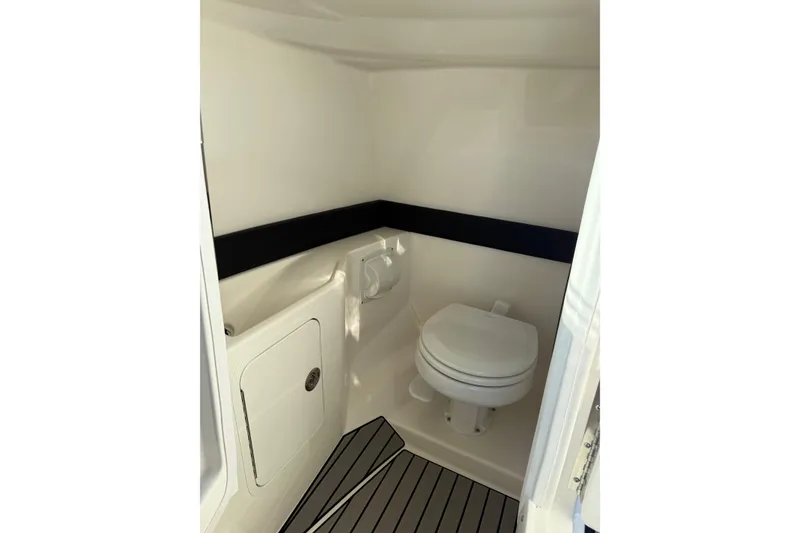 Slide: The Image of 2026 Sea Ray SLX 280 boat interior with modern marine toilet and sleek design. - 20
