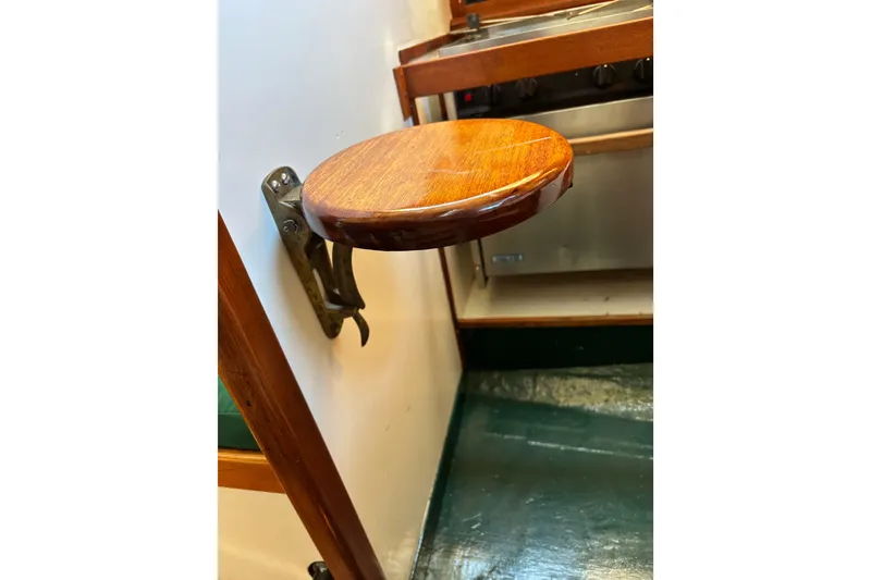 Slide: The Image of Wall-mounted wooden seat in a 1968 Spencer 35 boat interior. - 17