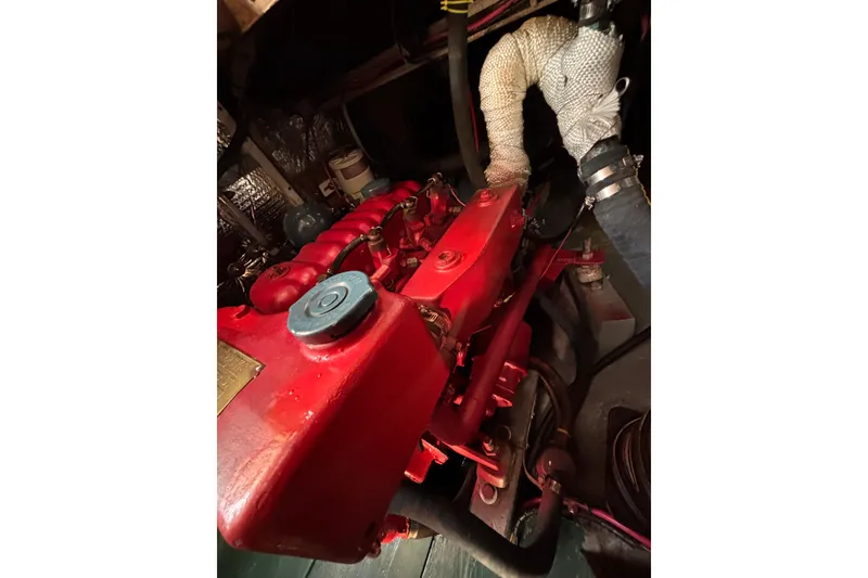 Slide: The Image of Red engine of a 1968 Spencer 35 boat, detailed view. - 32
