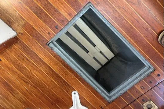 Slide: The Image of Wooden deck with open hatch on 1968 Spencer 35 boat. - 38