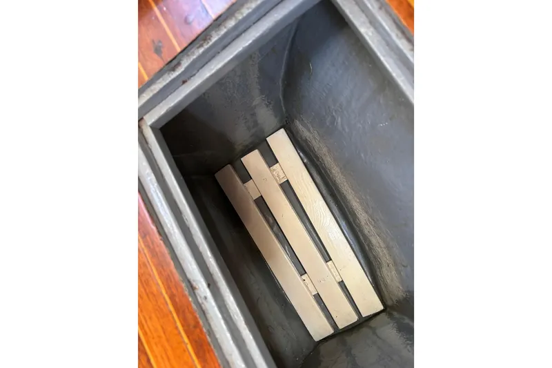 Slide: The Image of Interior view of a 1968 Spencer 35 boat compartment with wooden slats. - 39