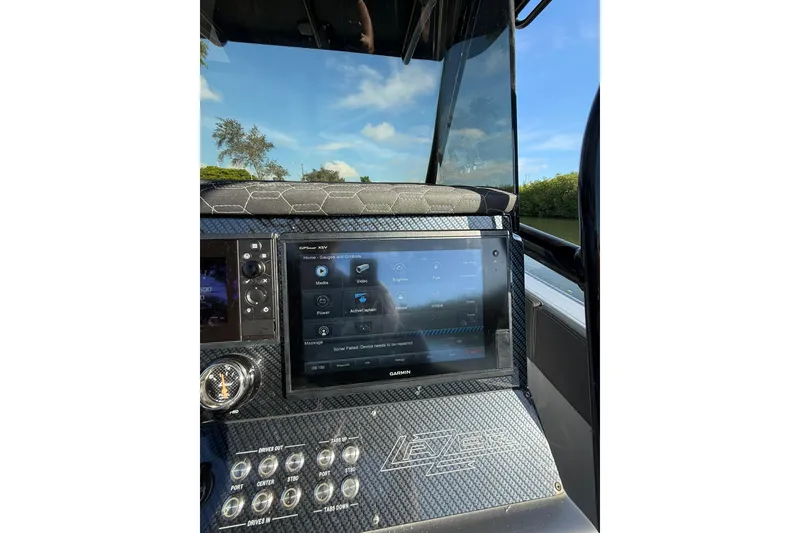 Slide: The Image of Dashboard of a 2006 Lazer 40 boat with Garmin GPS display. - 32