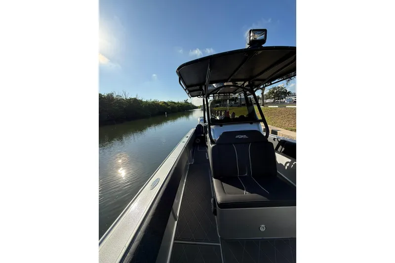 Slide: The Image of 2006 Lazer 40 boat on a calm river under a clear blue sky. - 43