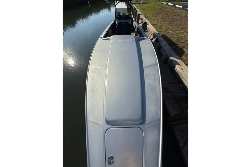 Slide: The Image of 2006 Lazer 40 boat docked by calm water, top view. - 46