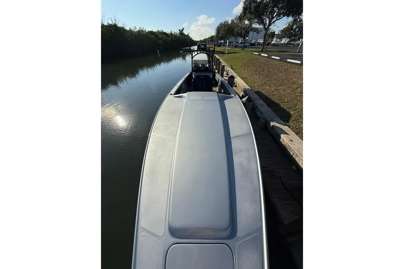 Slide: The Image of 2006 Lazer 40 boat docked on a calm canal under a clear sky. - 47
