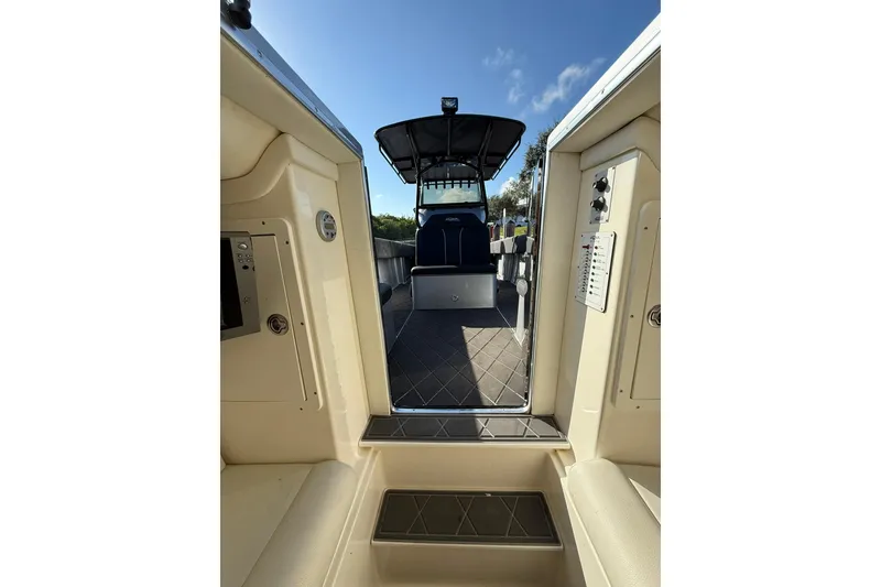 Slide: The Image of 2006 Lazer 40 boat interior with open deck view under clear blue sky. - 56