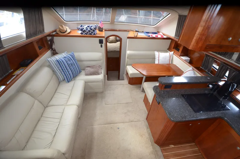 Slide: The Image of Interior of a 2007 Cruisers Yachts 415 Express Motoryacht with leather sofas. - 16
