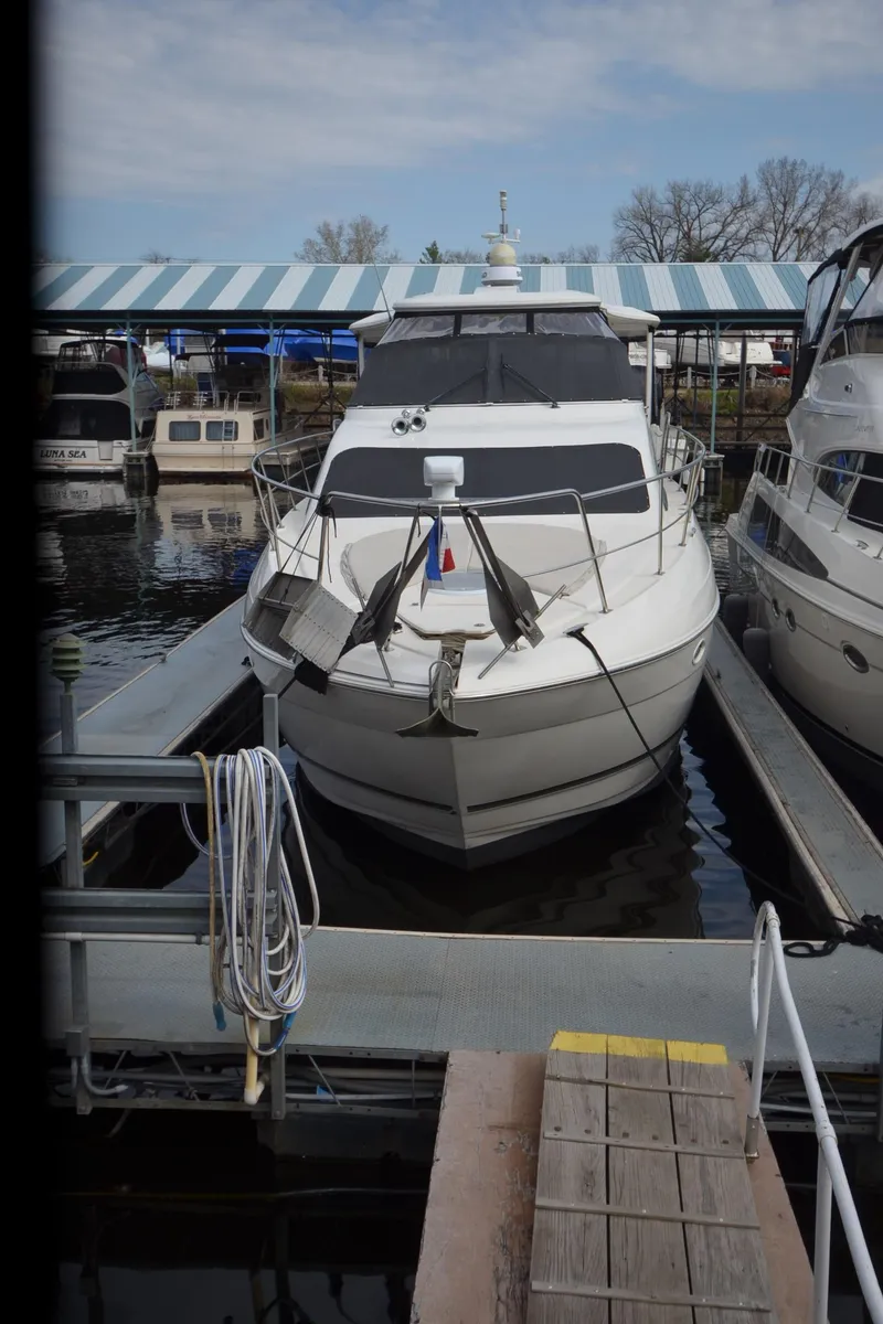Slide: The Image of 2007 Cruisers Yachts 415 Express Motoryacht docked in harbor. - 23