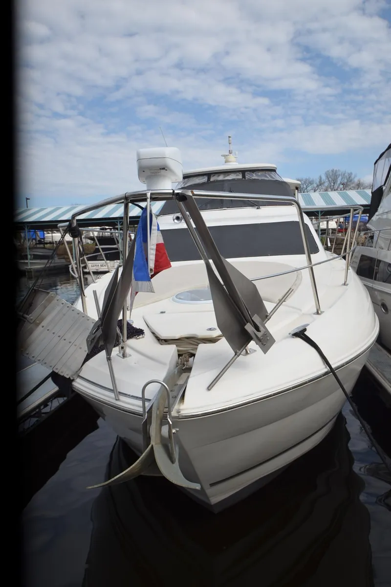 Slide: The Image of 2007 Cruisers Yachts 415 Express Motoryacht docked at marina. - 24