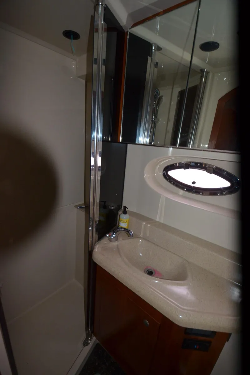 Slide: The Image of 2007 Cruisers Yachts 415 Express Motoryacht bathroom with sink and shower. - 25