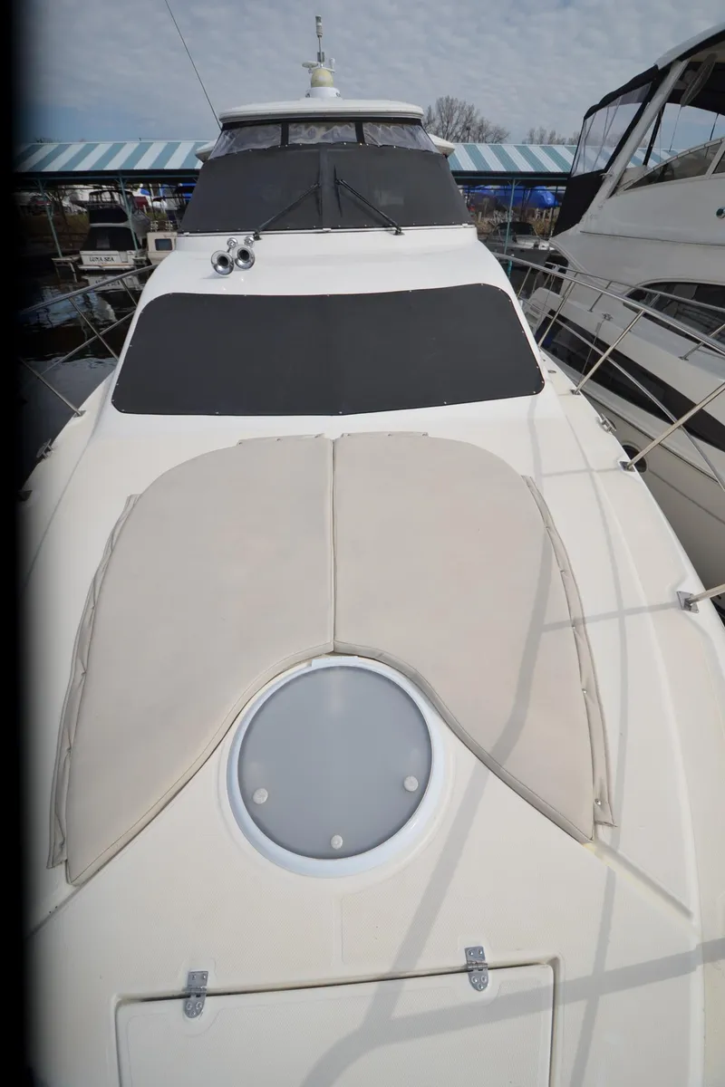 Slide: The Image of 2007 Cruisers Yachts 415 Express Motoryacht foredeck view in marina. - 27