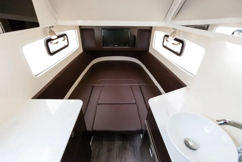 Slide: The Image of Manufacturer Provided Image: 2021 Scout 355 LXF cabin interior with bed, windows, and sink. - 109